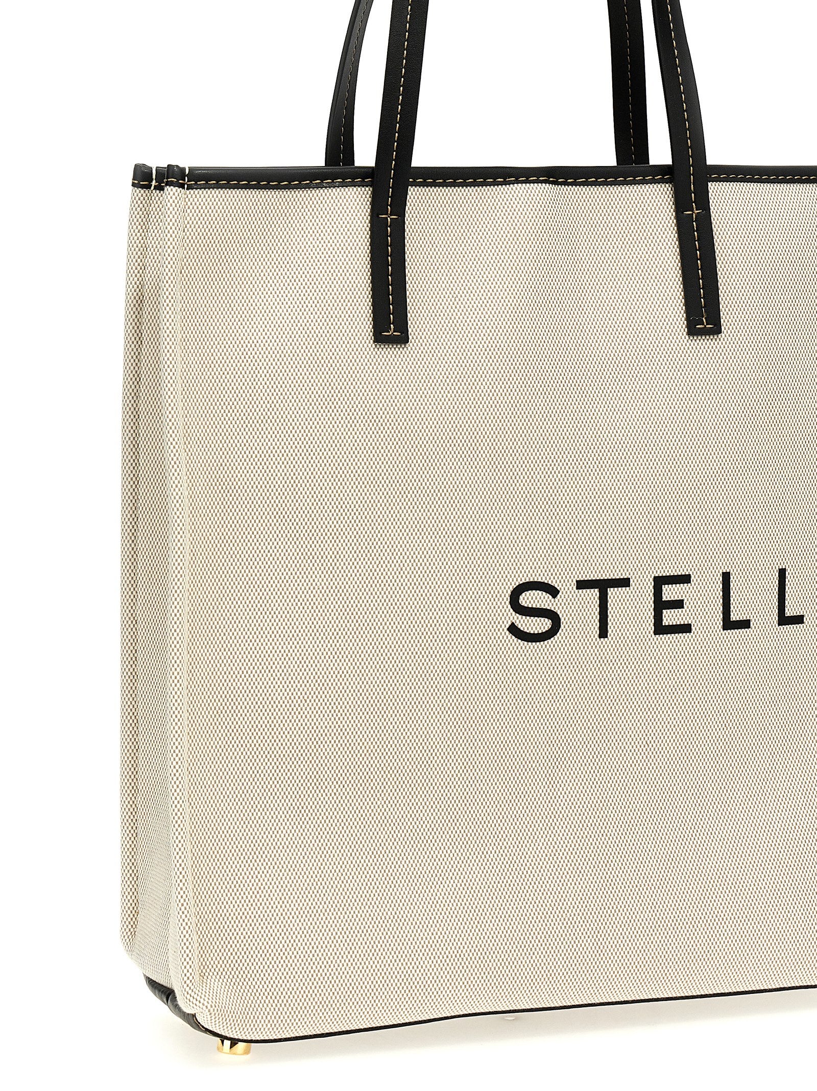Shopper Tote Bag by Stella McCartney for women in stretch cotton modal canvas beige & print showcases a statuesque Stretch Cotton Modal Canvas Shopper Tote Bag design, featuring a secure , ample , and versatile handle for a statuesque finish.