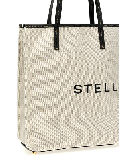 Shopper Tote Bag by Stella McCartney for women in stretch cotton modal canvas beige & print showcases a statuesque Stretch Cotton Modal Canvas Shopper Tote Bag design, featuring a secure , ample , and versatile handle for a statuesque finish.