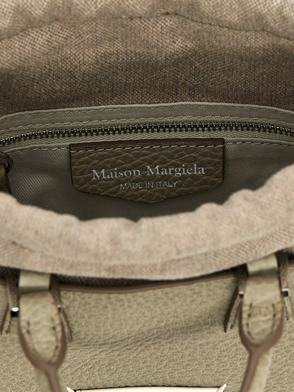 Drawstring Tote Handbag by Maison Margiela for women in calfskin leather gray features a refined silhouette, showcasing a secure drawstring, organized , and versatile shoulder-strap & handle for a refined finish.