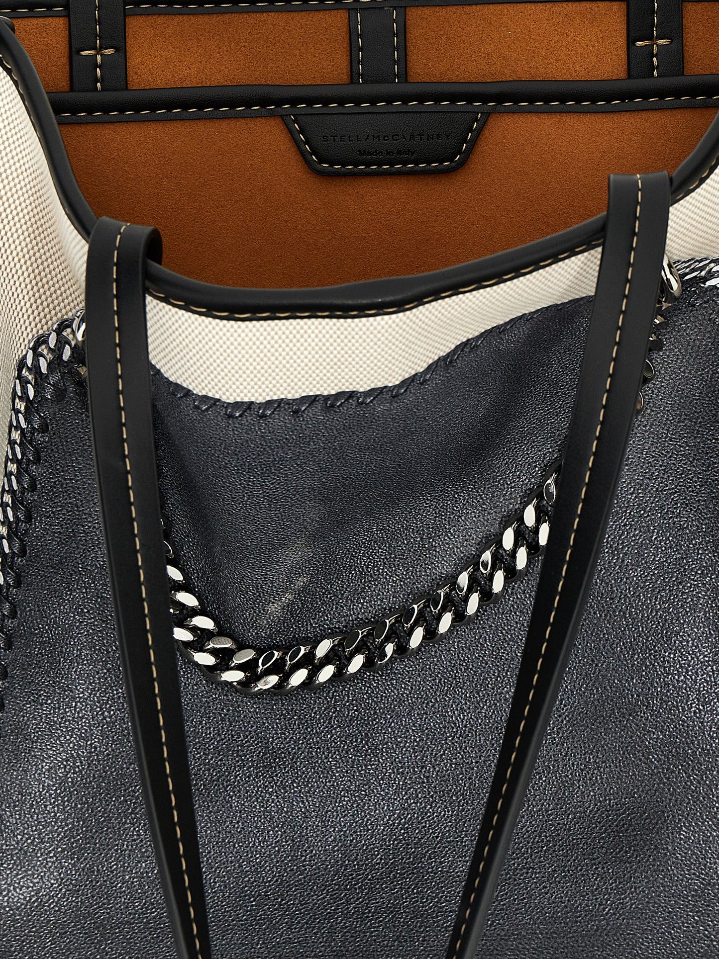 This Shopper Tote Bag by Stella McCartney for women in stretch cotton modal canvas multicolor & print features an jet-set Falabella Stretch Cotton Modal Canvas Shopper Tote Bag design with a secure hook, ample , and jet-set handle.