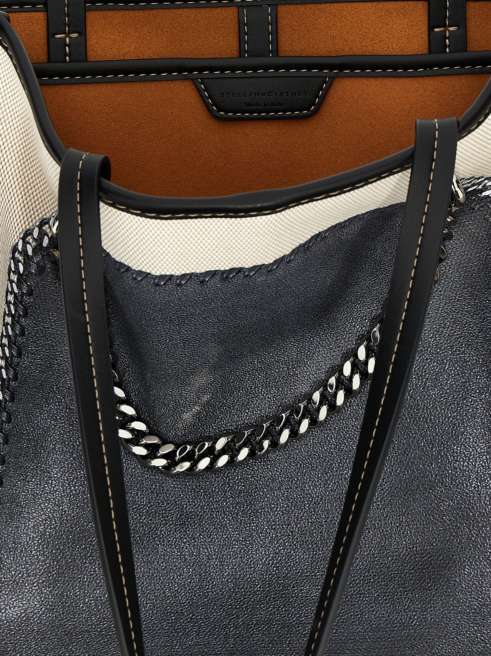 This Shopper Tote Bag by Stella McCartney for women in stretch cotton modal canvas multicolor & print features an jet-set Falabella Stretch Cotton Modal Canvas Shopper Tote Bag design with a secure hook, ample , and jet-set handle.
