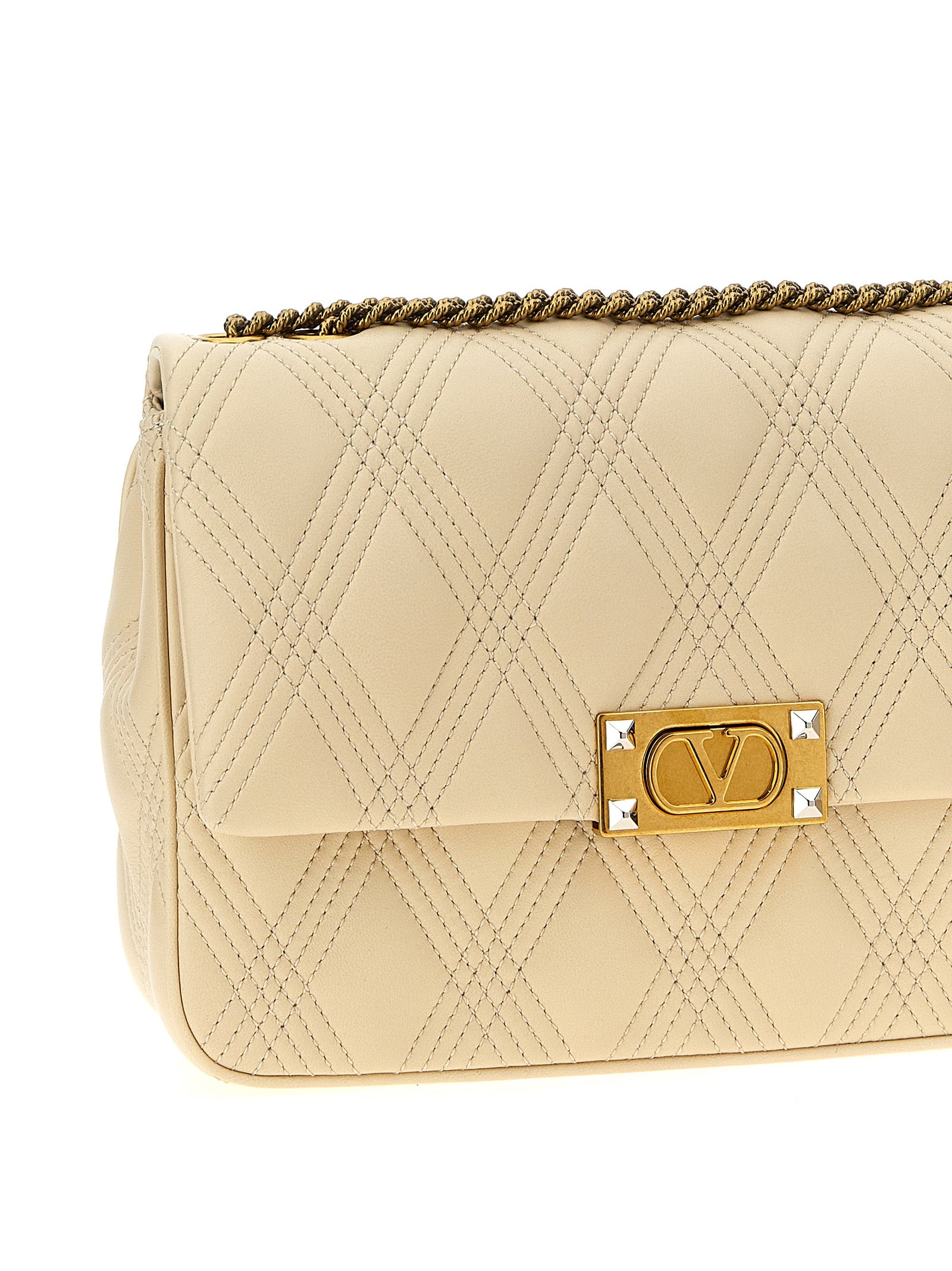 Quilted Shoulder Flap Bag by Valentino Garavani for women in lamb leather white & signature features a effortless chic silhouette with a secure flap, ample , and versatile shoulder-strap for a effortless chic finish.