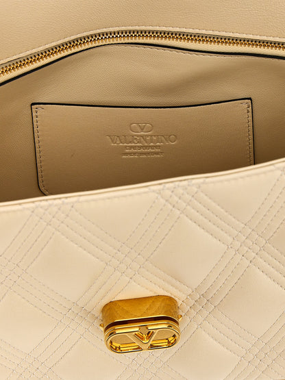 Quilted Shoulder Flap Bag by Valentino Garavani for women in lamb leather white & signature features a statuesque silhouette, showcasing a secure flap and statuesque with versatile shoulder-strap for a statuesque finish.