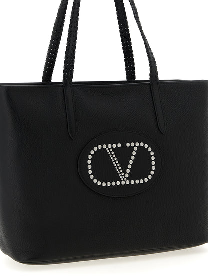 This Shopper Tote Bag by Valentino Garavani for women in bos taurus calf suede leather black & signature features an jet-set Nellcote V Logo Bos Taurus Calf Suede Leather Shopper Tote Bag design with a secure zipper, ample , and jet-set handle.