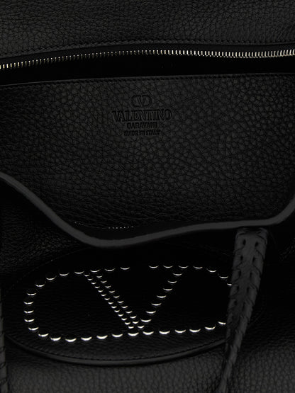 Shopper Tote Bag by Valentino Garavani for women in bos taurus calf suede leather black & signature features an jet-setting Nellcote V Logo Bos Taurus Calf Suede Leather Shopper Tote Bag design with a secure zipper, jet-setting , and versatile handle for a jet-setting look.