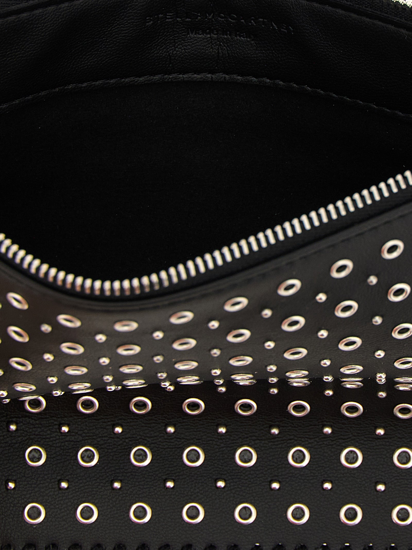 Shoulder Bag by Stella McCartney for women in polyurethane leather black & signature presents a statuesque silhouette, showcasing a secure zipper and statuesque with versatile shoulder-strap & handle for a sophisticated look.
