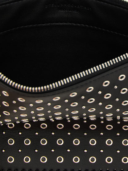 Shoulder Bag by Stella McCartney for women in polyurethane leather black & signature presents a statuesque silhouette, showcasing a secure zipper and statuesque with versatile shoulder-strap & handle for a sophisticated look.