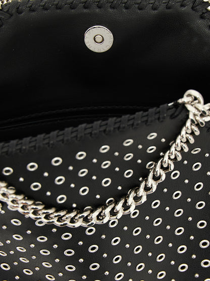 Handbag by Stella McCartney for women in polyurethane leather black features a exquisite silhouette, showcasing a secure magnetic and exquisite with versatile shoulder-strap & handle for a exquisite finish.