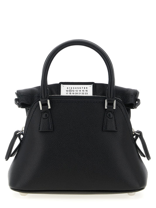 Micro Handbag by Maison Margiela for women in calfskin leather black & signature features a ornamental silhouette, showcasing a secure zipper, ample , and ornamental shoulder-strap & handle for a sophisticated look.