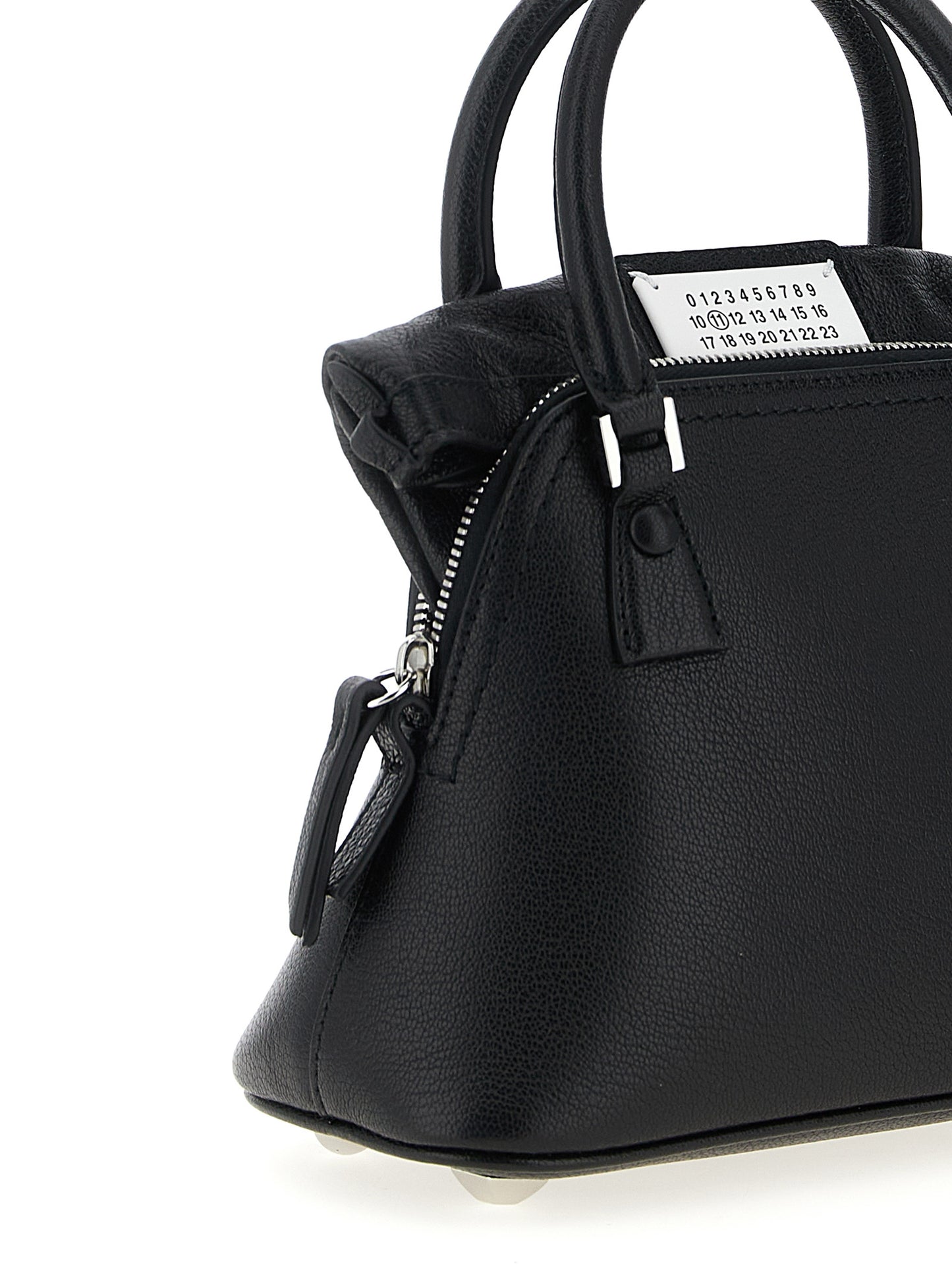 Micro Handbag by Maison Margiela for women in calfskin leather black & signature features an refined silhouette, showcasing a secure zipper, ample , and versatile shoulder-strap & handle for a sophisticated refined aesthetic.
