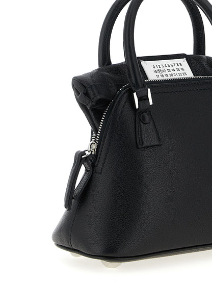 Micro Handbag by Maison Margiela for women in calfskin leather black & signature features an refined silhouette, showcasing a secure zipper, ample , and versatile shoulder-strap & handle for a sophisticated refined aesthetic.
