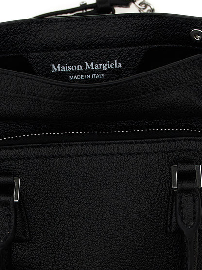 Micro Handbag by Maison Margiela for women in calfskin leather black & signature features a signature silhouette, showcasing a secure zipper and signature with versatile shoulder-strap & handle for a sophisticated look.
