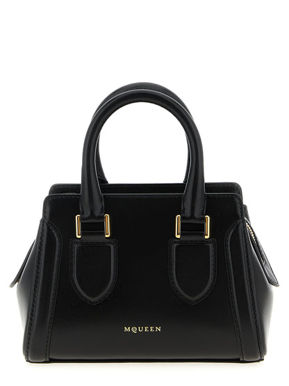 This Mini Crossbody Handbag by Alexander McQueen for women in calfskin leather and black presents a sculptural silhouette featuring a secure zipper, ample , and versatile crossbody-strap, shoulder-strap, adjustable-strap & handle for a sculptural finish.