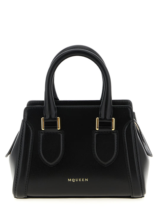 This Mini Crossbody Handbag by Alexander McQueen for women in calfskin leather and black presents a sculptural silhouette featuring a secure zipper, ample , and versatile crossbody-strap, shoulder-strap, adjustable-strap & handle for a sculptural finish.