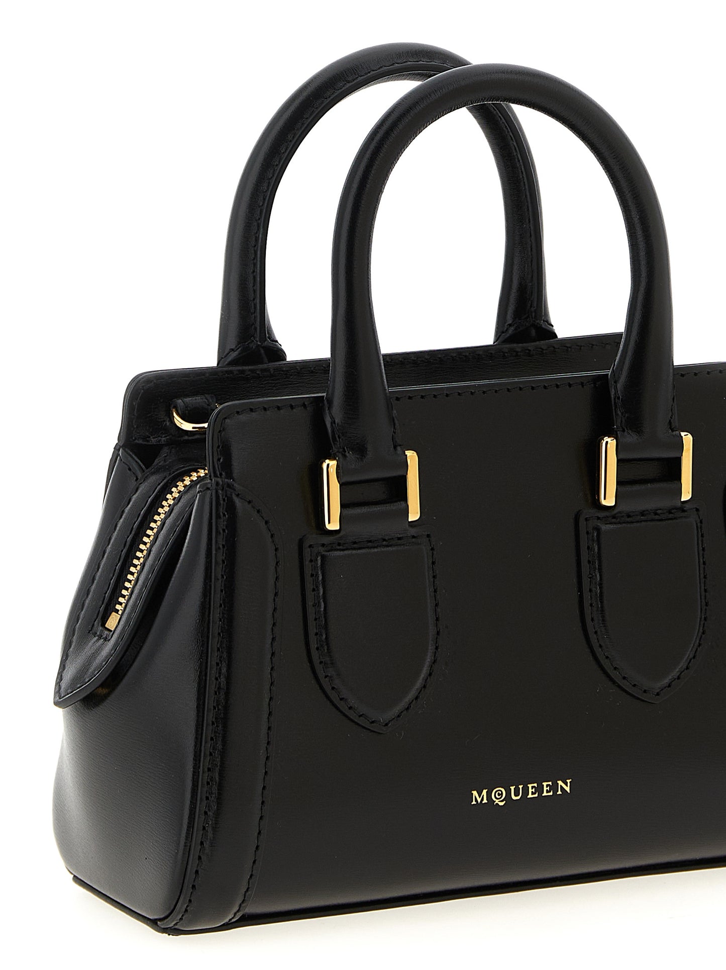 This Mini Crossbody Handbag by Alexander McQueen for women in calfskin leather and black presents a sculptural silhouette featuring a secure zipper, ample , and versatile crossbody-strap, shoulder-strap, adjustable-strap & handle for a sculptural finish.