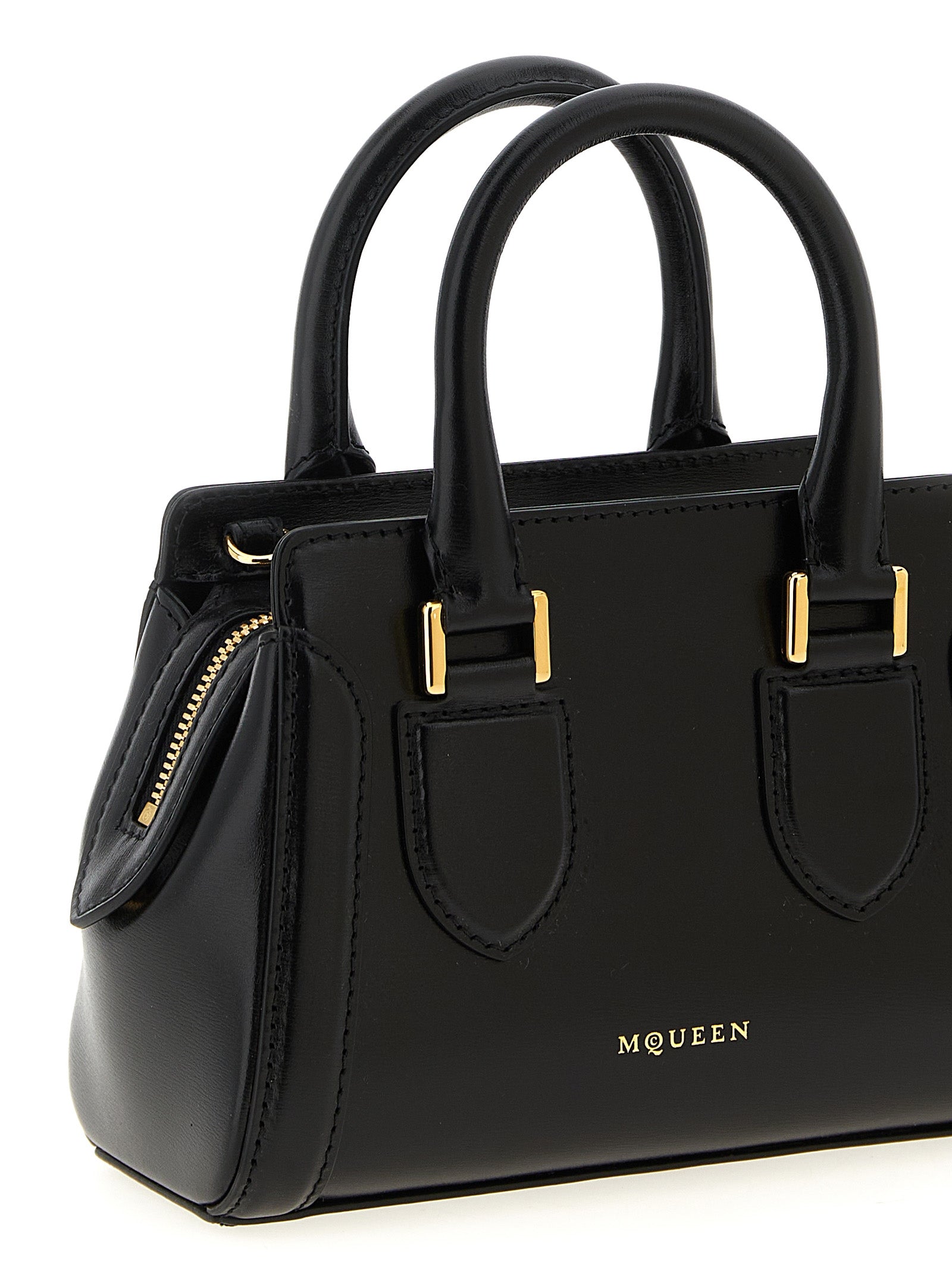 This Mini Crossbody Handbag by Alexander McQueen for women in calfskin leather and black presents a sculptural silhouette featuring a secure zipper, ample , and versatile crossbody-strap, shoulder-strap, adjustable-strap & handle for a sculptural finish.