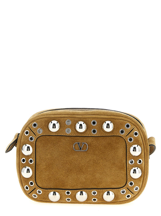 Crossbody Messenger Handbag by Valentino Garavani for unisex in suede leather beige & signature features an versatile silhouette, showcasing a secure zipper and versatile with versatile crossbody-strap, shoulder-strap & adjustable-strap for a versatile finish.