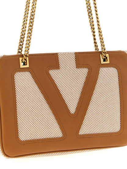 Small Shoulder Bag by Valentino Garavani for men in cotton polyester canvas brown & signature features a statuesque silhouette, showcasing a secure zipper and statuesque with versatile shoulder-strap & handle for a statuesque finish.