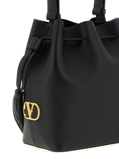 Shoulder Drawstring Bag by Valentino Garavani for women in calfskin leather black & signature features a statuesque silhouette, showcasing a secure drawstring and statuesque with versatile shoulder-strap, adjustable-strap & handle for a statuesque finish.
