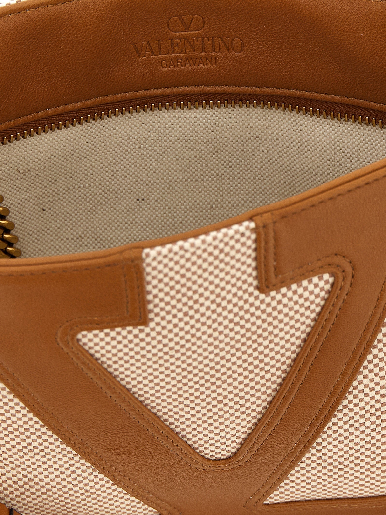 Small Shoulder Bag by Valentino Garavani for men in cotton polyester canvas brown & signature presents a statuesque silhouette, showcasing a secure zipper and statuesque with versatile shoulder-strap & handle for a sophisticated look.
