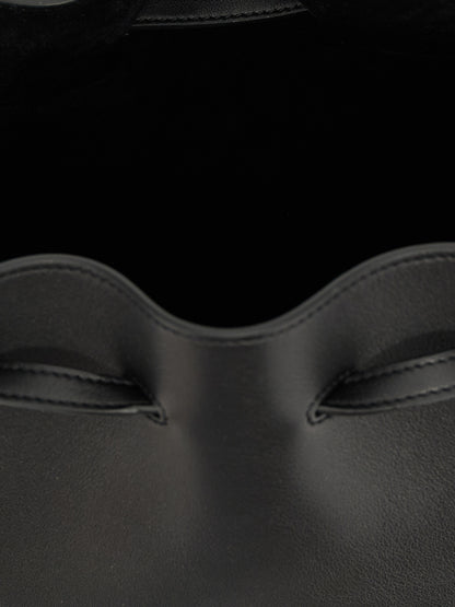 Shoulder Drawstring Bag by Valentino Garavani for women in calfskin leather black & signature features a stately silhouette, showcasing a secure drawstring, ample , and stately shoulder-strap, adjustable-strap & handle for a stately finish.