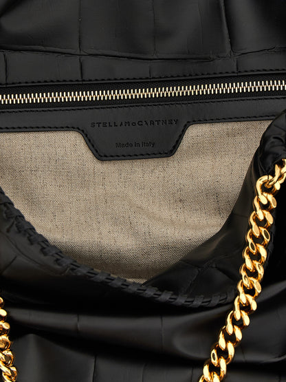 Shopper Tote Bag by Stella McCartney for women in calf leather & aluminium black & monogram features a jet-set Falabella The Monogram Calf Leather & Aluminium Shopper Tote Bag design, complete with a secure magnetic, ample , and versatile handle for a jet-set look.