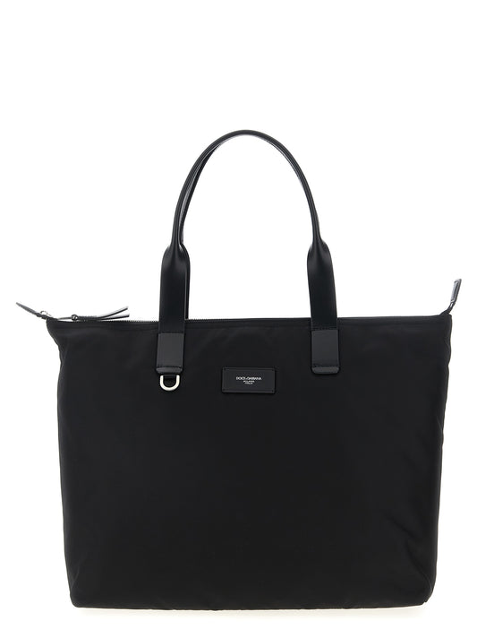 Medium Shopper Tote Bag by Dolce & Gabbana for men in leather & nylon black features an jet-setting Leather Nylon Medium Shopper Tote Bag design with a secure zipper, jet-setting , and versatile handle for a jet-setting look.