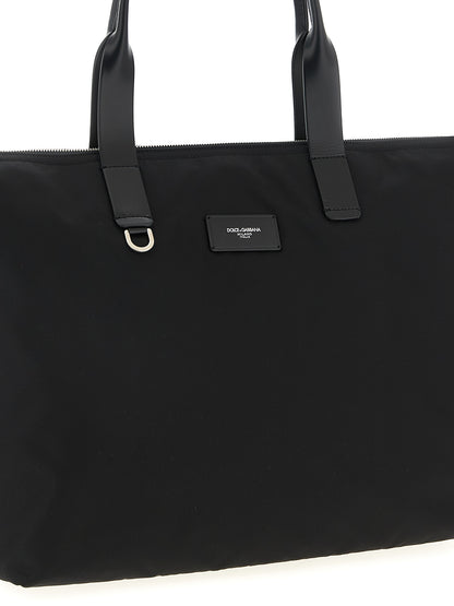Medium Shopper Tote Bag by Dolce & Gabbana for men in leather & nylon black features a jet-set Leather Nylon Medium Shopper Tote Bag design, complete with a secure zipper, ample , and versatile handle for a jet-set look.