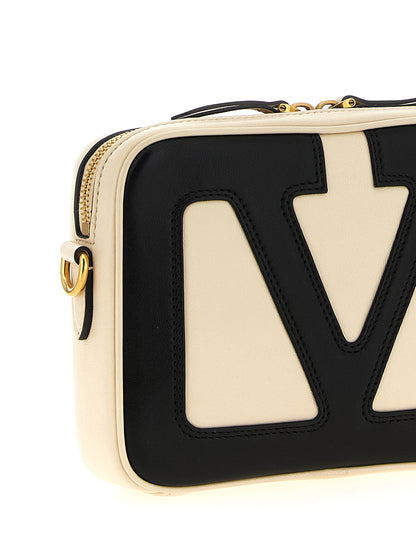 Crossbody Messenger Handbag by Valentino Garavani for unisex in polyester bicolour, black, white & signature features a transformative elegance silhouette, showcasing a secure zipper, organized , and versatile crossbody-strap, shoulder-strap & adjustable-strap for a transformative elegance look.