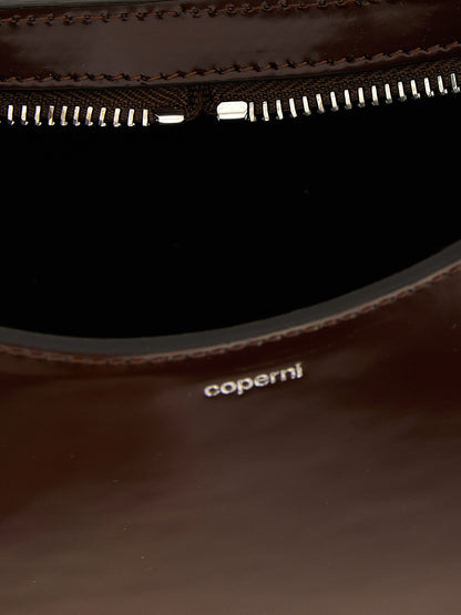 Handbag by Coperni for women in leather brown features an refined silhouette, showcasing a secure zipper, ample , and versatile handle for a sophisticated refined aesthetic.
