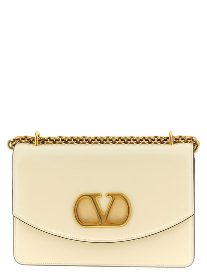 Shoulder Flap Bag by Valentino Garavani for women in calfskin leather white & signature features a effortless chic silhouette with a secure flap & magnetic, ample , and versatile shoulder-strap for a effortless chic finish.