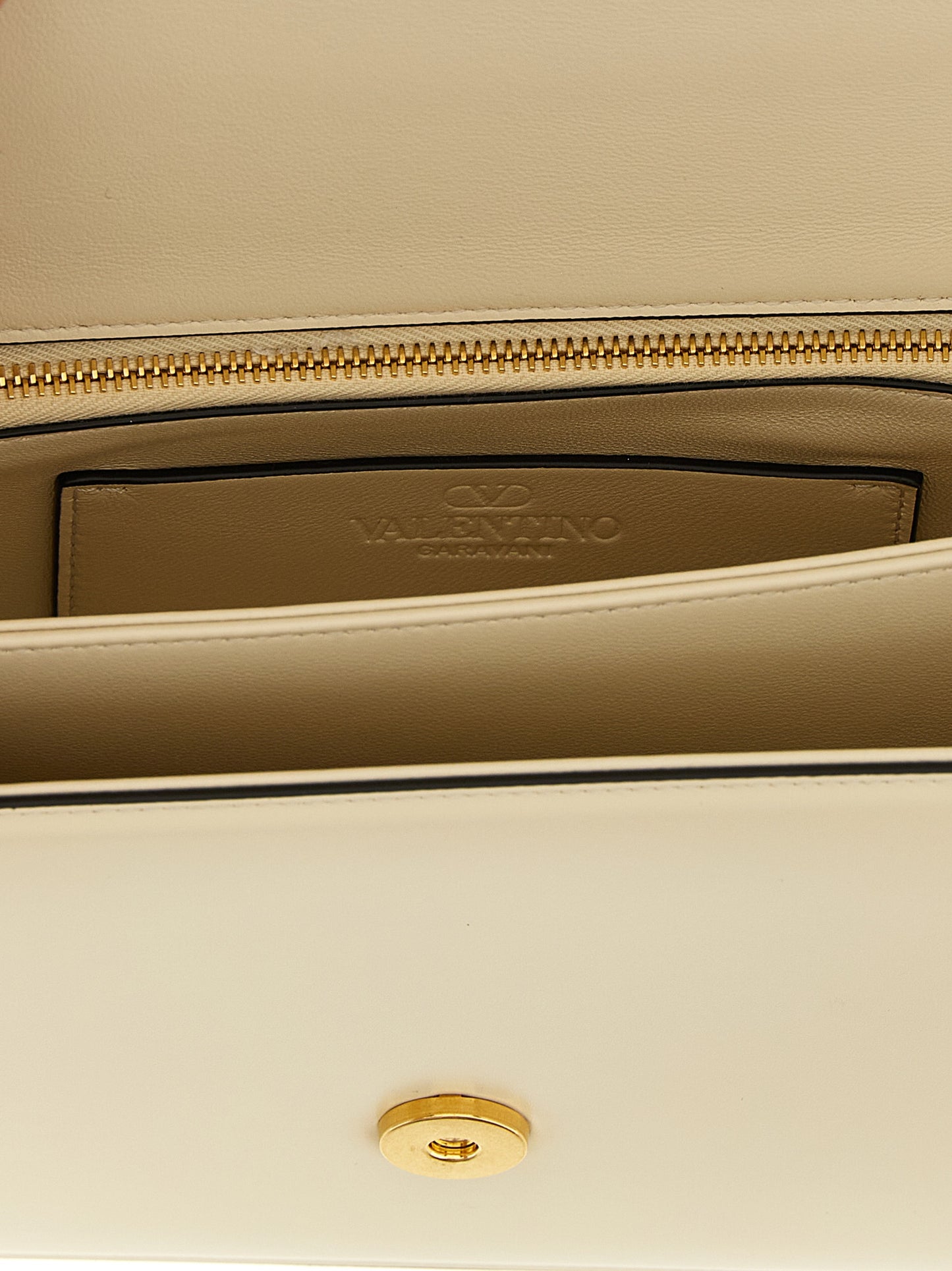 Shoulder Flap Bag by Valentino Garavani for women in calfskin leather white & signature features a effortless chic silhouette with a secure flap & magnetic, ample , and versatile shoulder-strap for a effortless chic finish.