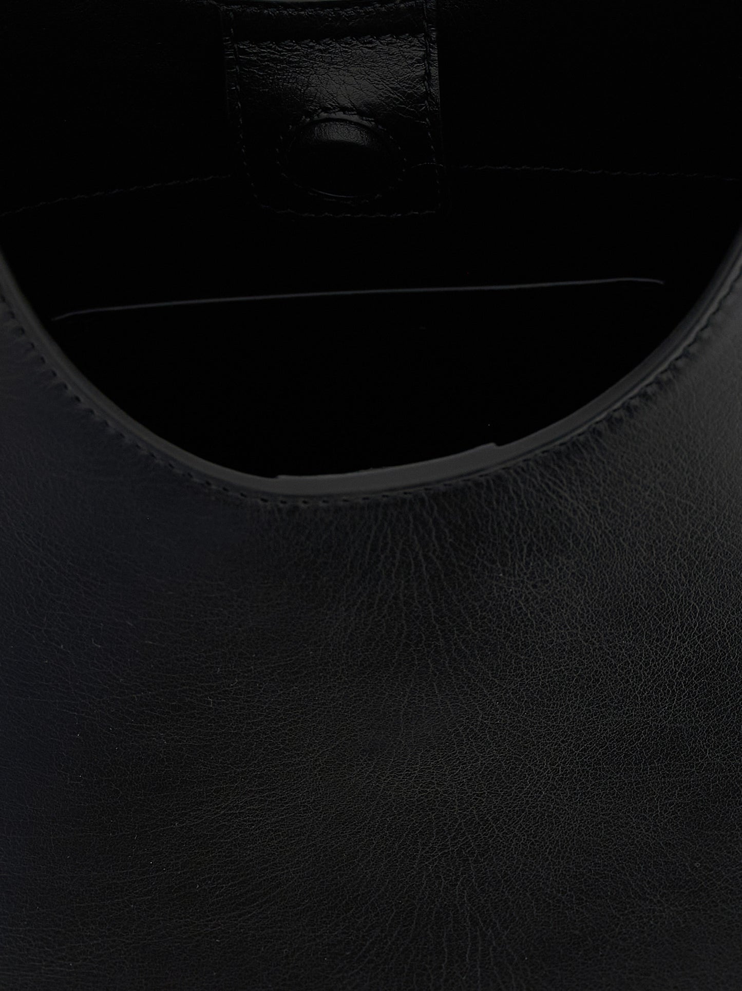 Shoulder Bag by Jil Sander for women in bos taurus suede calf leather black features a enviable silhouette, showcasing a secure magnetic & buckle, ample , and enviable shoulder-strap, adjustable-strap & handle for a enviable finish.