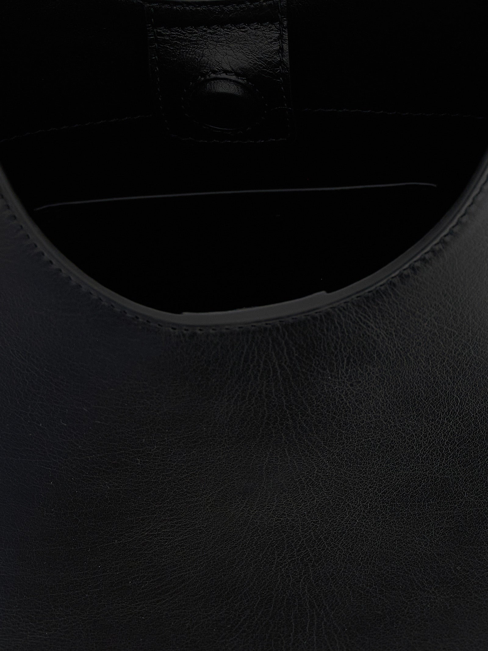 Shoulder Bag by Jil Sander for women in bos taurus suede calf leather black features a enviable silhouette, showcasing a secure magnetic & buckle, ample , and enviable shoulder-strap, adjustable-strap & handle for a enviable finish.