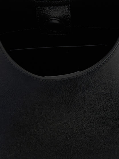 Shoulder Bag by Jil Sander for women in bos taurus suede calf leather black features a enviable silhouette, showcasing a secure magnetic & buckle, ample , and enviable shoulder-strap, adjustable-strap & handle for a enviable finish.