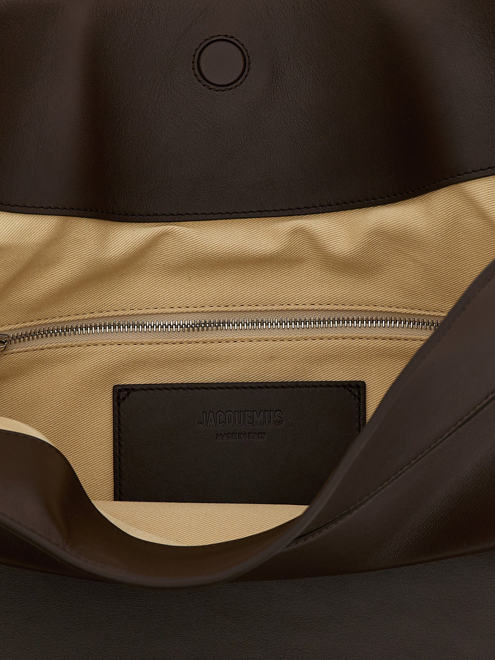 Shoulder Flap Bag by Jacquemus for women in calfskin leather brown features a effortless sophistication silhouette, secured by a flap, magnetic & button with ample and versatile shoulder-strap, adjustable-strap & handle for a effortless sophistication finish.
