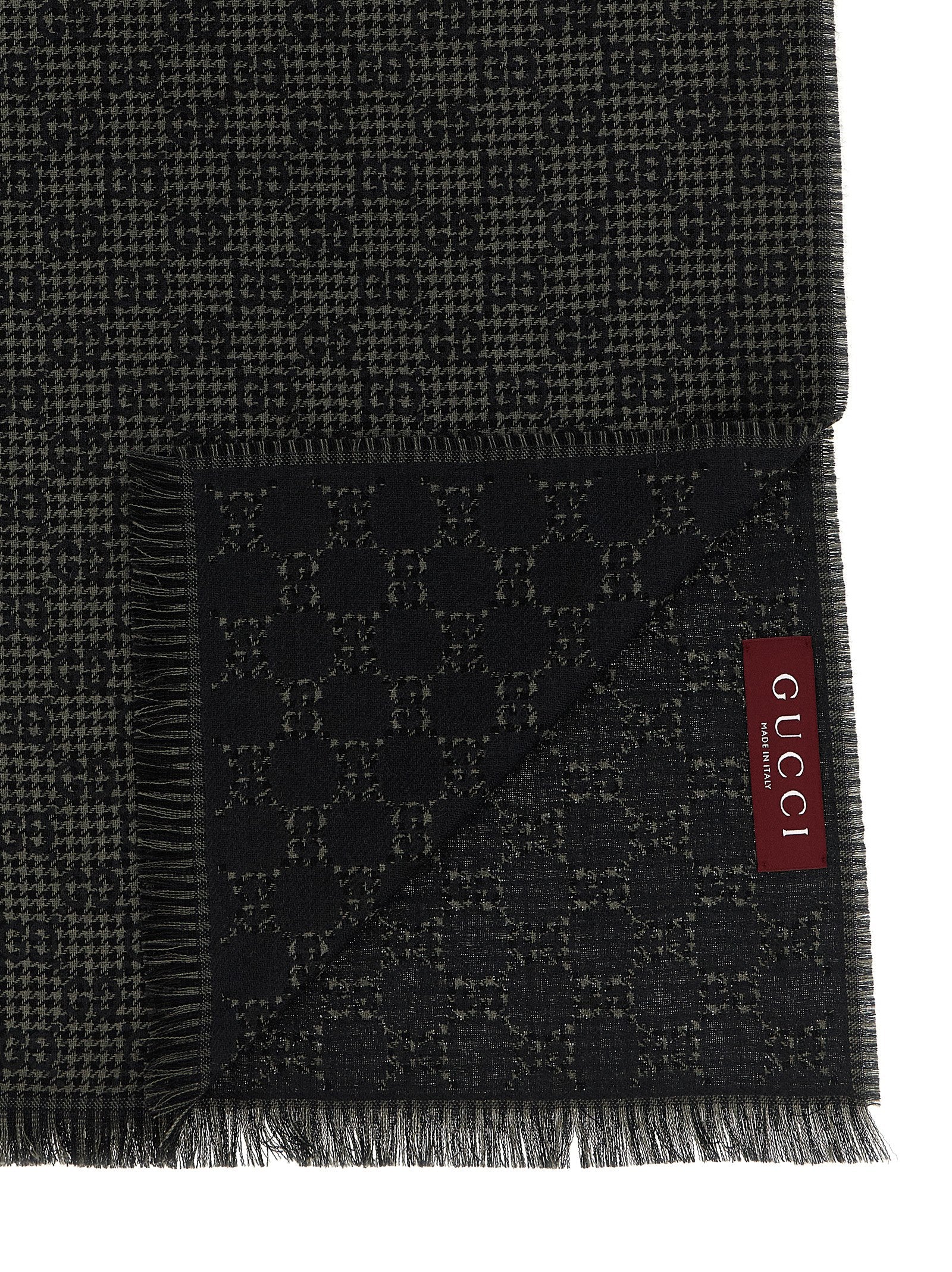 Scarf by Gucci for men in wool & silk multicolor & jacquard showcases a warm silhouette from the Gg Wool & Silk Foulard Wrap Fringes Scarf collection, offering a warm drape that exudes sophisticated luxury.