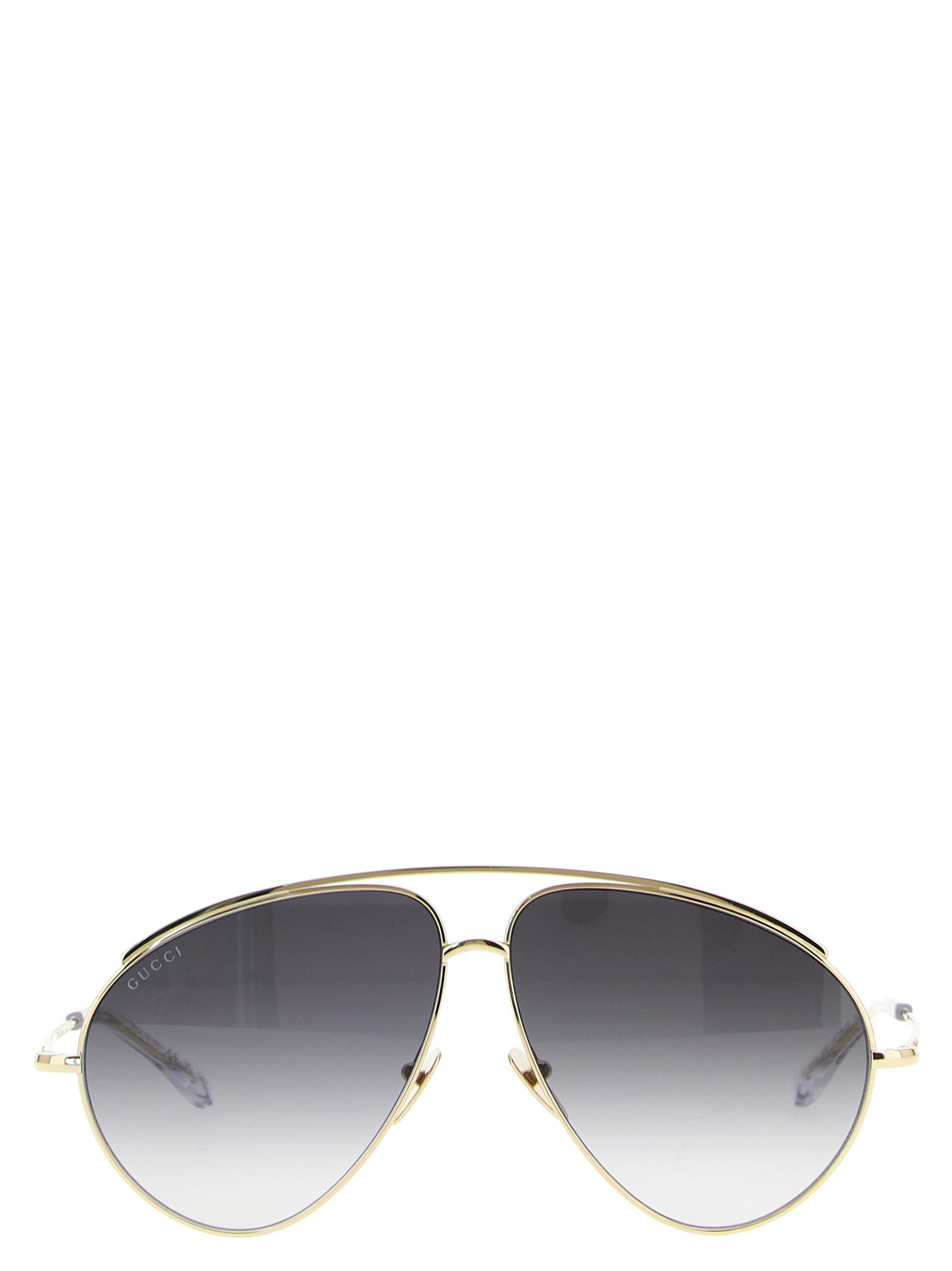 This Sunglasses by Gucci for women in acetate & polyamide gold presents a sumptuous silhouette, showcasing a sumptuous aviator frame design in gold coloured frame and high-performance .