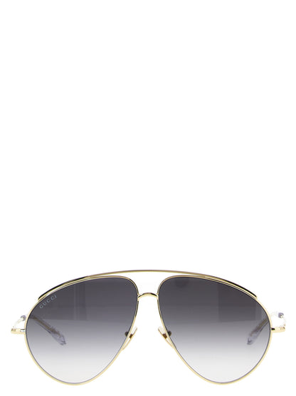 This Sunglasses by Gucci for women in acetate & polyamide gold presents a sumptuous silhouette, showcasing a sumptuous aviator frame design in gold coloured frame and high-performance .