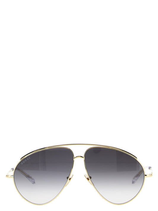 This Sunglasses by Gucci for women in acetate & polyamide gold presents a sumptuous silhouette, showcasing a sumptuous aviator frame design in gold coloured frame and high-performance .