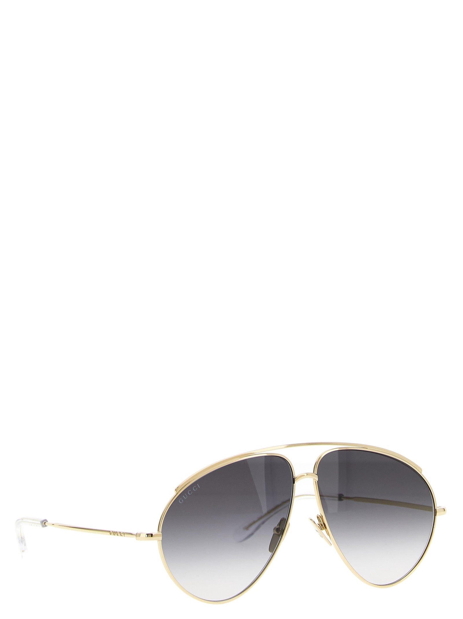 Sunglasses by Gucci for women in acetate & polyamide gold features a contemporary silhouette, showcasing a contemporary aviator frame design in gold coloured frame with high-performance .