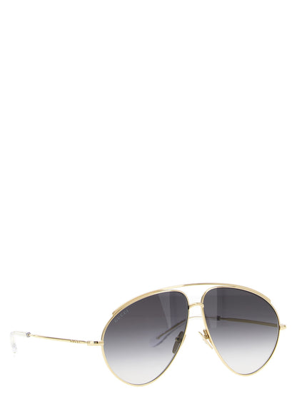 Sunglasses by Gucci for women in acetate & polyamide gold features a contemporary silhouette, showcasing a contemporary aviator frame design in gold coloured frame with high-performance .