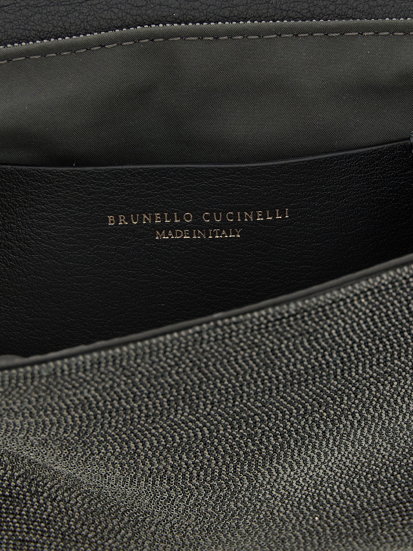 Shoulder Flap Clutch Handbag by Brunello Cucinelli for women in leather black features a statuesque silhouette, showcasing a secure flap & magnetic and organized with versatile shoulder-strap & adjustable-strap for statuesque evening wear.