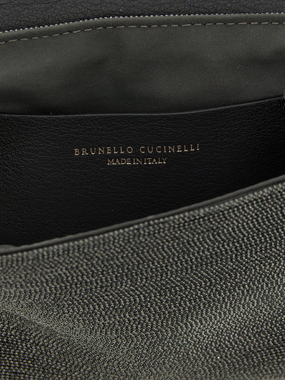 Shoulder Flap Clutch Handbag by Brunello Cucinelli for women in leather black features a statuesque silhouette, showcasing a secure flap & magnetic and organized with versatile shoulder-strap & adjustable-strap for statuesque evening wear.