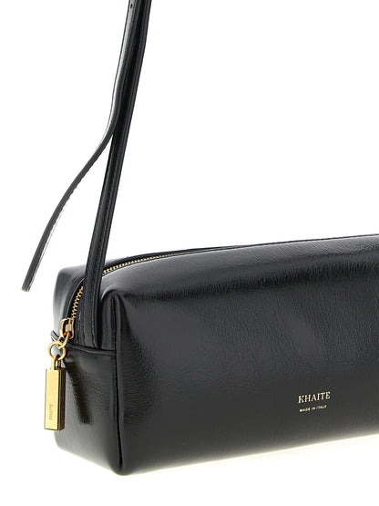 Mini East West Crossbody Handbag by Khaite for women in calfskin leather black features a transformative sophistication silhouette, showcasing a secure zipper, ample , and versatile crossbody-strap, shoulder-strap & adjustable-strap for a transformative sophistication look.