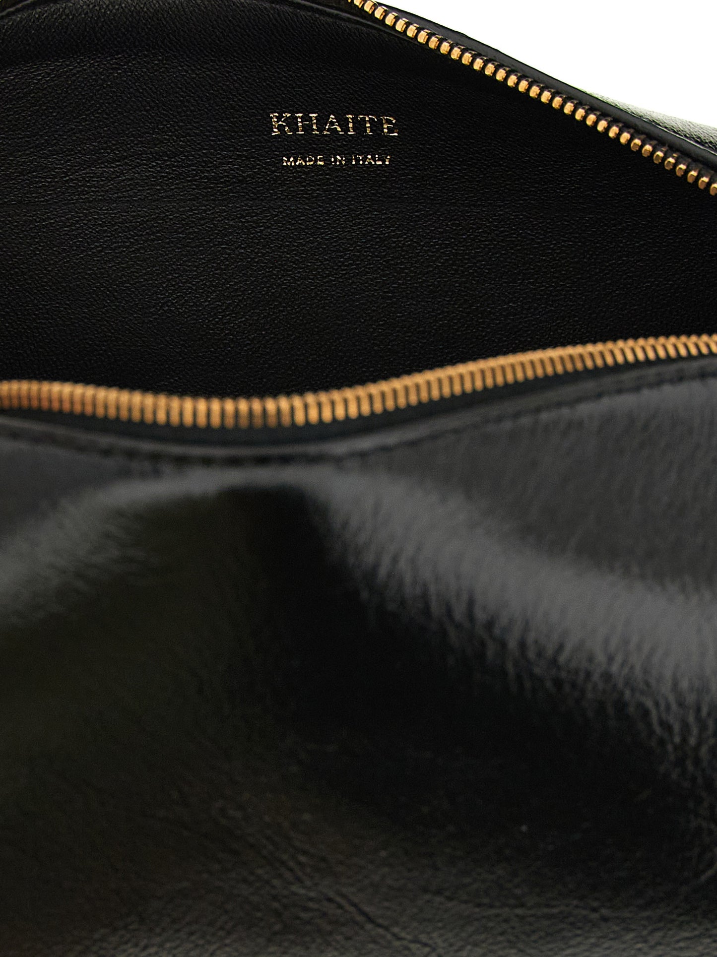 Mini East West Crossbody Handbag by Khaite for women in calfskin leather black features a multifaceted silhouette, showcasing a secure zipper and multifaceted with versatile crossbody-strap, shoulder-strap & adjustable-strap for multifaceted style.