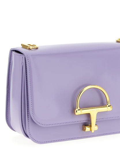 2-in-1 Shoulder & Crossbody Flap Bag by Gucci for women in calfskin leather purple presents a statuesque silhouette, showcasing a secure flap and statuesque with versatile crossbody-strap, shoulder-strap & adjustable-strap for a sophisticated look.