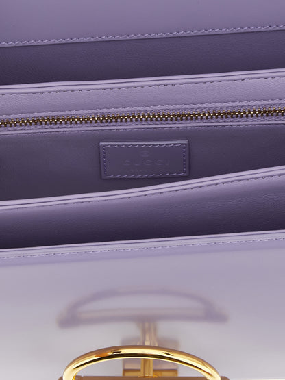 2-in-1 Shoulder & Crossbody Flap Bag by Gucci for women in calfskin leather purple showcases a statuesque silhouette, artfully detailed with a secure flap, organized , and versatile crossbody-strap, shoulder-strap & adjustable-strap for a statuesque look.