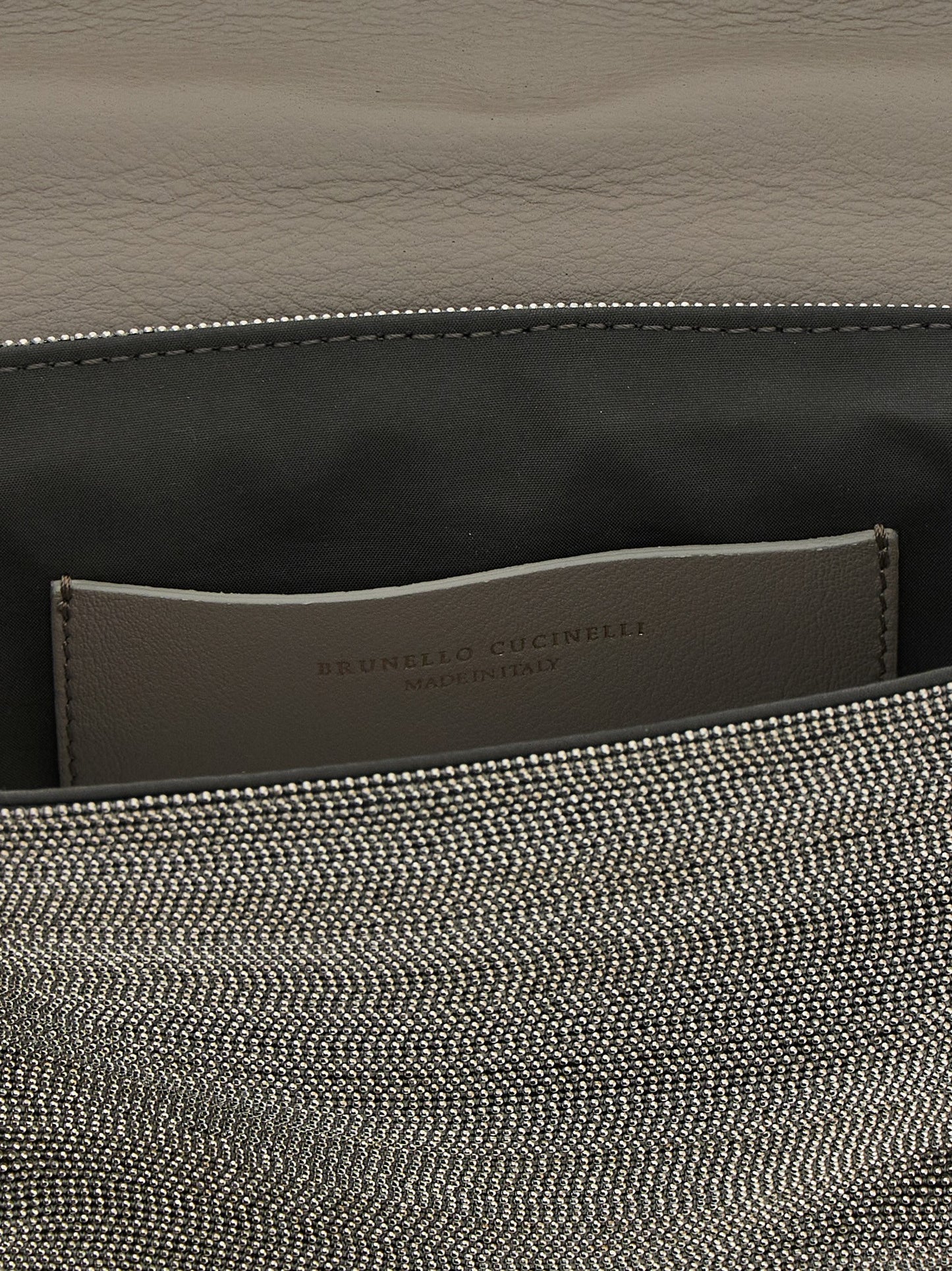 Crossbody Flap Clutch Handbag by Brunello Cucinelli for women in nappa leather & rubber silver features an sculptural silhouette, showcasing a secure flap & magnetic and sculptural with versatile crossbody-strap, shoulder-strap & adjustable-strap for a sophisticated look.