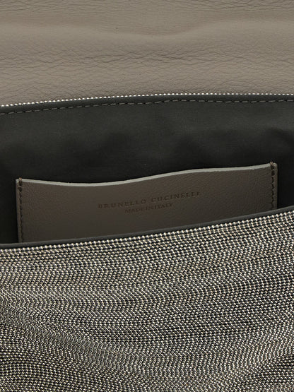 Crossbody Flap Clutch Handbag by Brunello Cucinelli for women in nappa leather & rubber silver features an sculptural silhouette, showcasing a secure flap & magnetic and sculptural with versatile crossbody-strap, shoulder-strap & adjustable-strap for a sophisticated look.